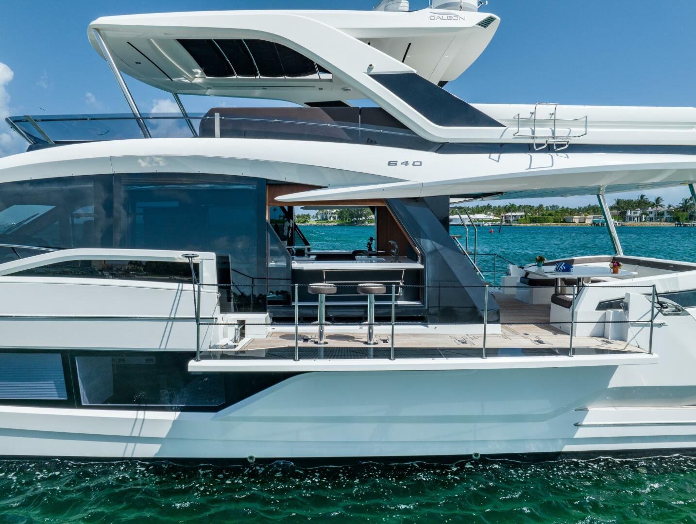 Galeon 64 motor yacht cruising on the water near Miami